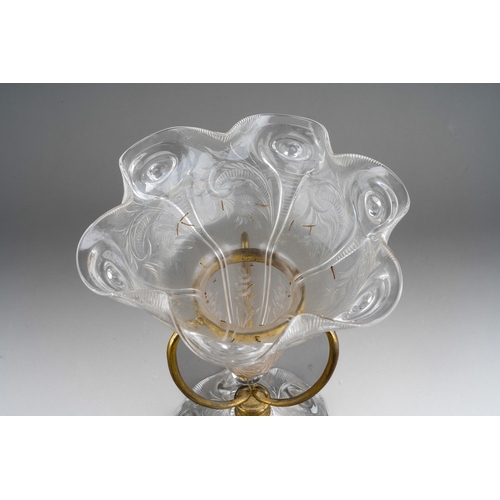 130 - A late 19th century clear glass single vase epergne in a gilt metal frame, probably John Walsh Walsh... 