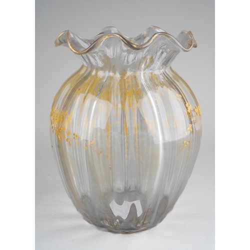 132 - A late 19th clear glass and gilt decorated vase of squat ribbed baluster form, wavy rim, foliate des... 