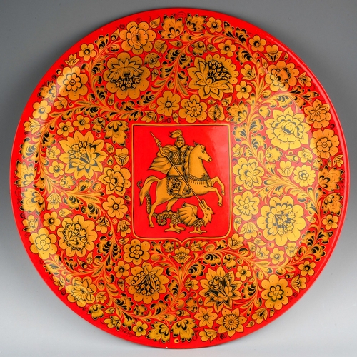 234 - A 20th Century Russian large circular red and gold papier mache plaque with central Coat of Arms for... 