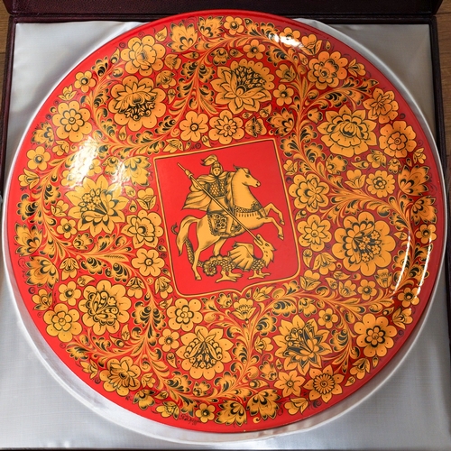 234 - A 20th Century Russian large circular red and gold papier mache plaque with central Coat of Arms for... 