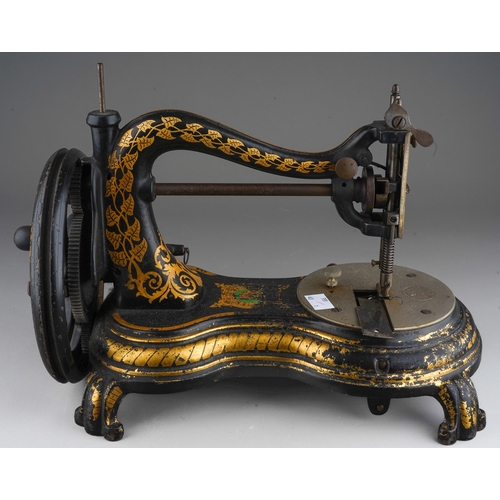 239 - A Victorian cast iron Jones swan neck table top manual sewing machine, figure of eight shaped base, ... 