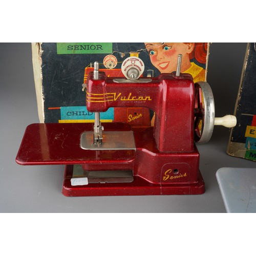 242 - Four vintage Child`s sewing machines including a blue boxed 