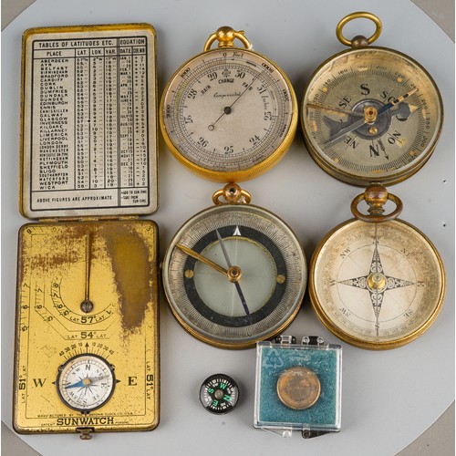 243 - A group of 19th Century and early 20th Century brass and gilt metal cased compasses including a Anco... 