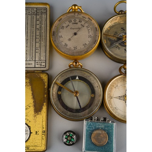 243 - A group of 19th Century and early 20th Century brass and gilt metal cased compasses including a Anco... 