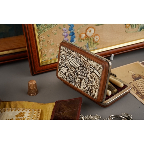 244 - An early 20th Century needlework handbag with pin cushion and needle holder, decorated with flowers ... 