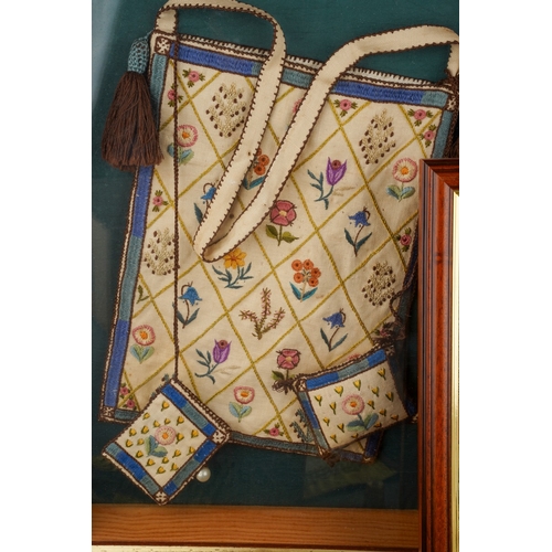 244 - An early 20th Century needlework handbag with pin cushion and needle holder, decorated with flowers ... 