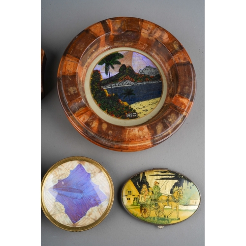 246 - Three various Rio de Janeiro reverse glass butterfly wing wood mounted ashtrays with a Rio brass mou... 