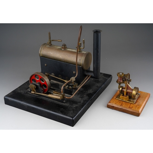 271 - A model live steam engine, lacks, burner, the metal base bearing copper plaque engraved 