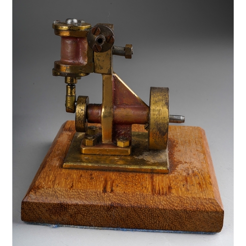 271 - A model live steam engine, lacks, burner, the metal base bearing copper plaque engraved 