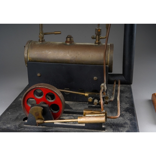 271 - A model live steam engine, lacks, burner, the metal base bearing copper plaque engraved 