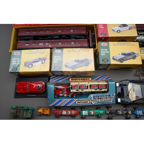 273 - Collection of toys and trains to include loose mainly Tri-Ang trains, tracks, accessories, boxed Tri... 