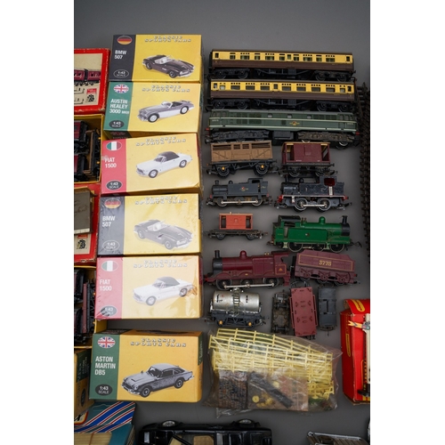 273 - Collection of toys and trains to include loose mainly Tri-Ang trains, tracks, accessories, boxed Tri... 