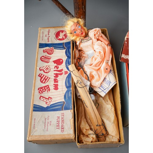 274 - A Lead Child's sewing machine with carrying box, a vintage boxed Pelham puppet (Cinderella) a boxed ... 