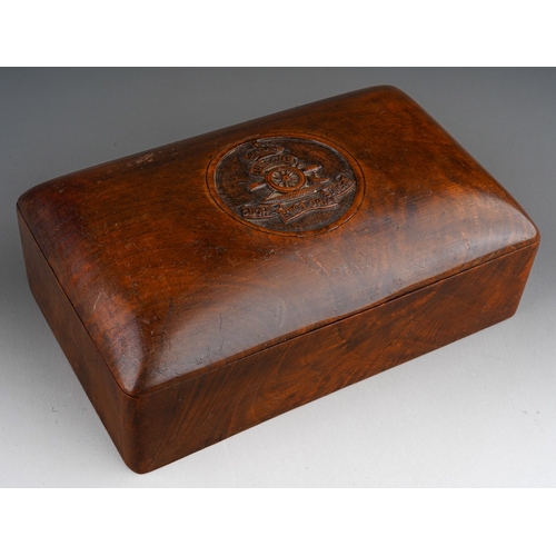 467 - An early 20th century hardwood cigarette box of rectangular form, the hinged rounded lid carved with... 