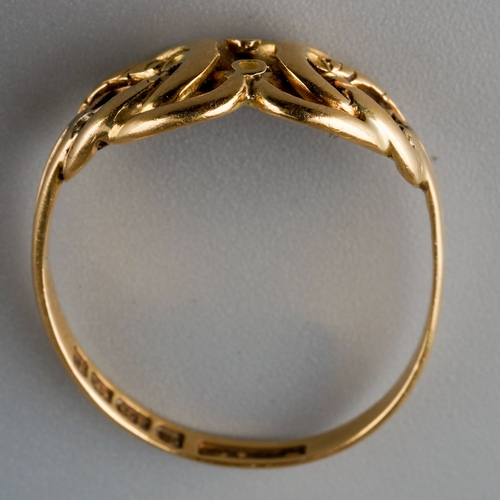 505 - An Edwardian 18ct gold ring, designed as a stylised knot, gemstone settings present but heavily worn... 