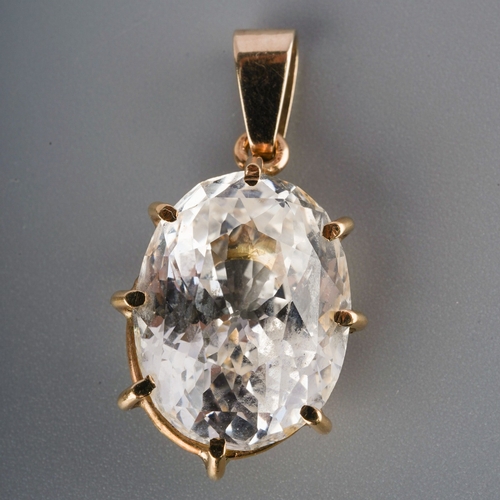 517 - A single stone pendant. Set with an oval shaped mixed cut white sapphire, measuring approx 15.83 - 1... 