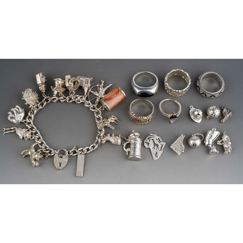 623 - Silver charm bracelet and loose charms, silver rings etc. Gross weight 126g