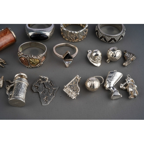 623 - Silver charm bracelet and loose charms, silver rings etc. Gross weight 126g