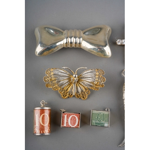 626 - Collection of silver jewellery to include bracelet, brooches, pendants  including reticulated fish e... 