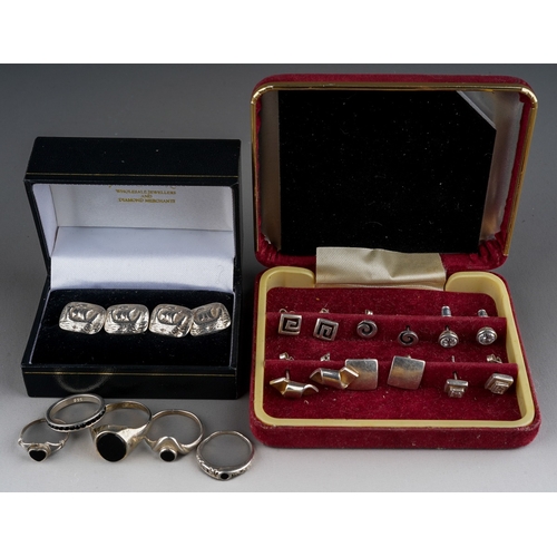 628 - A pair of silver cufflinks with boats (14g) , 5 silver rings set with black gemstones (11g) and 6 si... 