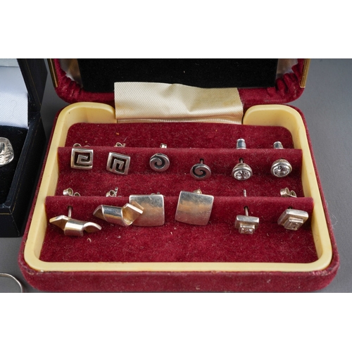 628 - A pair of silver cufflinks with boats (14g) , 5 silver rings set with black gemstones (11g) and 6 si... 