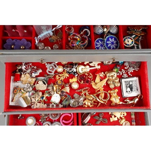 631 - Large collection of costume jewellery in grey set of jewellery draws to include earrings, brooches, ... 