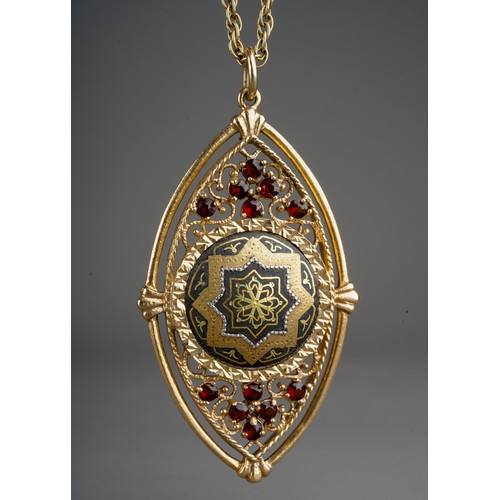 636 - A yellow metal gem set pendant with chain, the pendant set with a central metal panel, with garnet a...