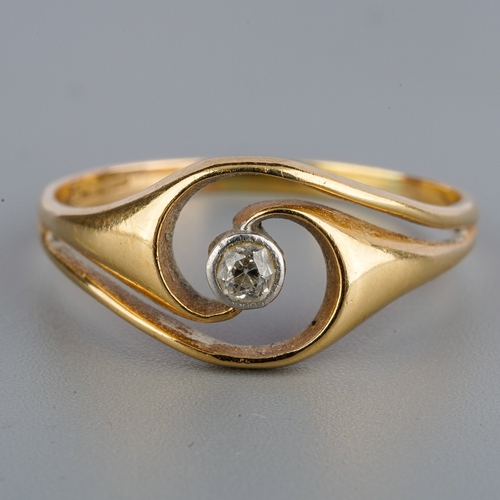 638 - An early 20th century gold diamond dress ring, set with an old European cut diamond, within a white ... 