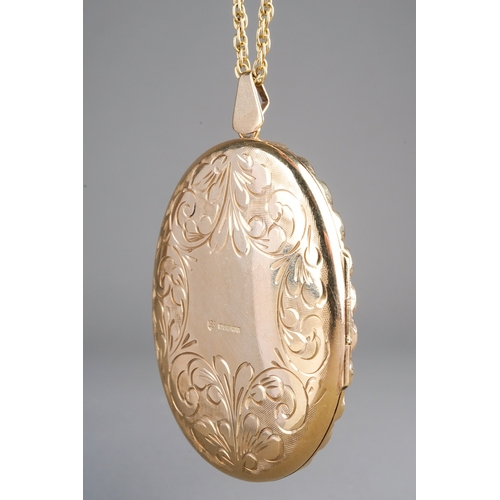 663 - 9k gold large locket and chain, front engraved with flowers, marked 375 to back and to chain. Gross ... 