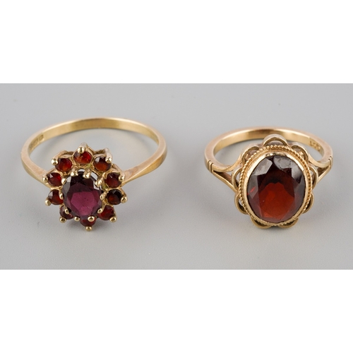 666 - Two yellow metal garnet rings, to include a 9ct gold garnet cluster ring, hallmarked 9ct gold, toget... 