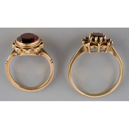 666 - Two yellow metal garnet rings, to include a 9ct gold garnet cluster ring, hallmarked 9ct gold, toget... 