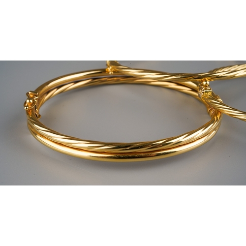 668 - 3 gold bangles, one marked 375, Italy, gross weight 6.2g, 2  marked 750 Italy, gross weight 8.2g