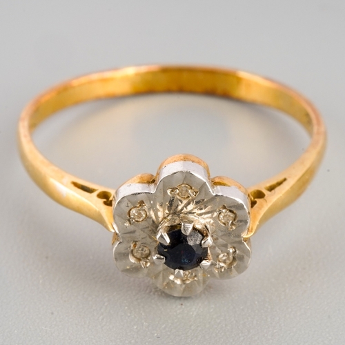 674 - An 18ct gold sapphire and diamond cluster ring, set with a central sapphire surrounded by single cut... 