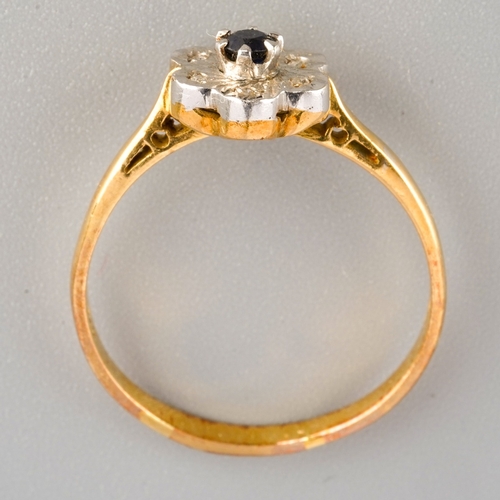 674 - An 18ct gold sapphire and diamond cluster ring, set with a central sapphire surrounded by single cut... 