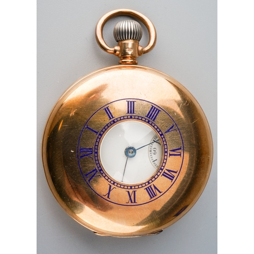 787 - An early 20th century 9ct gold half hunter pocket watch. The white enamel dial with black Roman nume... 