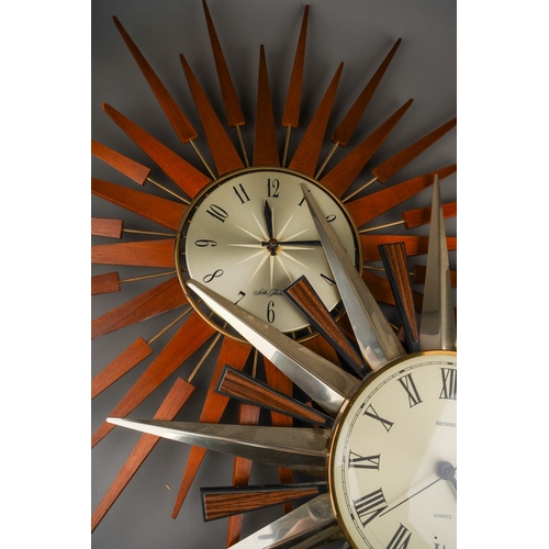 885 - A Seth Thomas of Scotland teak and metal quartz sunburst wall clock, with Arabic numerals, width 66c... 