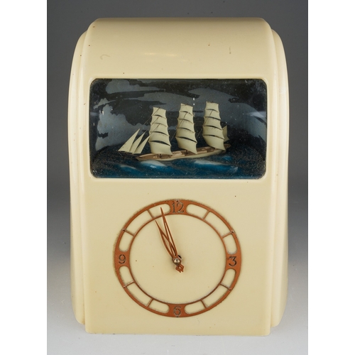 886 - A cream bakelite cased Vitascope automaton mantel clock, circa 1940, electric movement, the perspex ... 