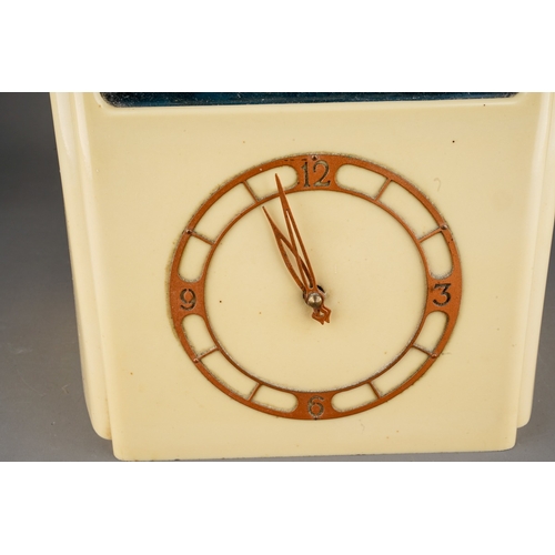 886 - A cream bakelite cased Vitascope automaton mantel clock, circa 1940, electric movement, the perspex ... 