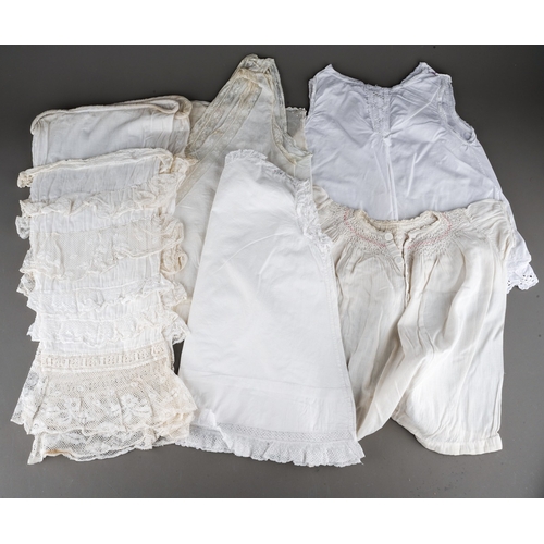 890 - A box containing a collection of vintage childrens costume, mainly cotton and lace, some broiderie a... 