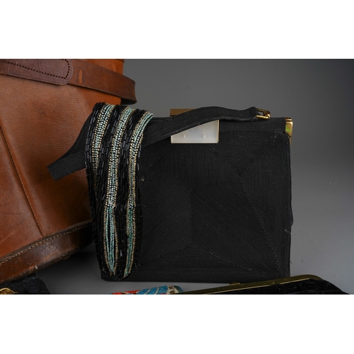 891 - A small collection of vintage bags, including a Norris brown leather pail shaped bag, a black croche... 