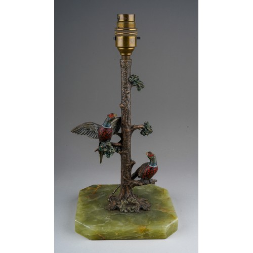 895 - A cold painted bronze lamp base cast as two pheasants in a tree, mounted on a rectangular green onyx... 