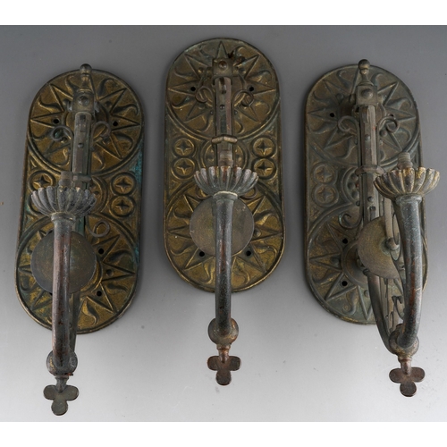 898 - A set of three late 19th century gilt brass and copper wall gas light fittings of Gothic style, roun... 