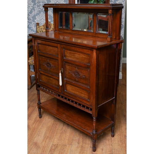 951 - An Arts & Crafts mahogany chiffonier, top section with three bevel glazed panels above cupboard door... 