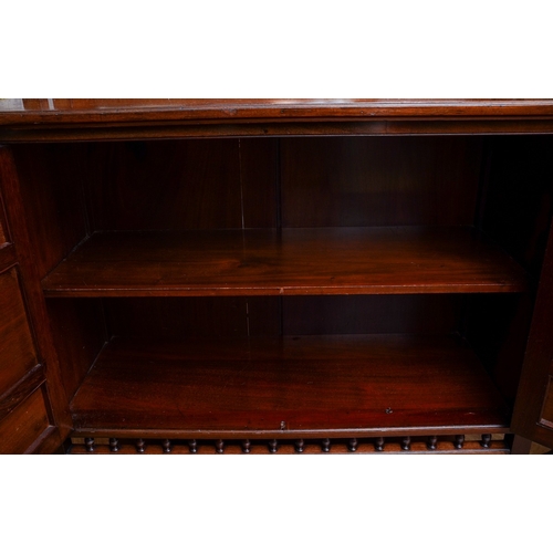 951 - An Arts & Crafts mahogany chiffonier, top section with three bevel glazed panels above cupboard door... 