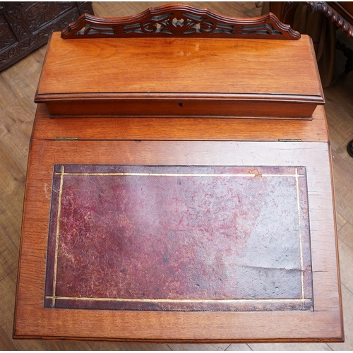 955 - An early 20th Century mahogany Davenport desk, fitted top section above leather slope front, each si... 