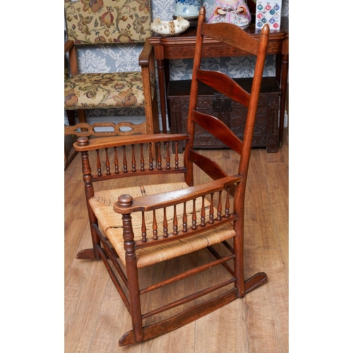 957 - A mahogany ladder back large rocking chair, balustrade arm supports, rope twist seat