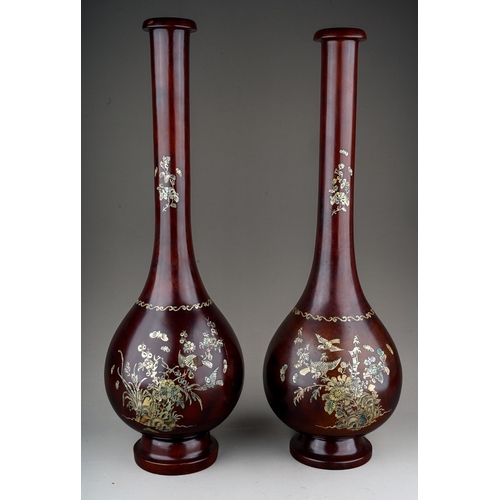 997 - Treen: a matched pair of Japanese hardwood and mother-of-pearl inlaid, bottle shaped on circular bas... 