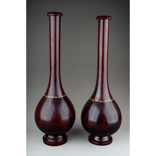 997 - Treen: a matched pair of Japanese hardwood and mother-of-pearl inlaid, bottle shaped on circular bas... 