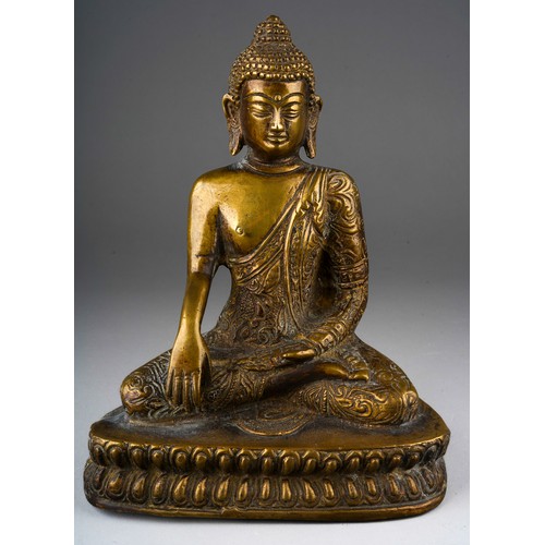 998 - A gilt bronze seated buddha