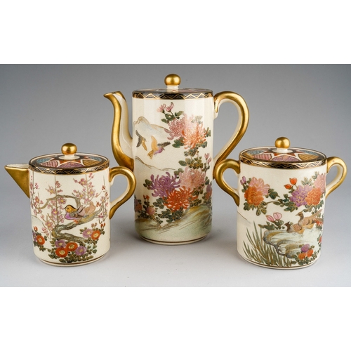 1002 - An early 20th century Japanese Satsuma pottery three piece coffee set of cylindrical form, the lids ... 